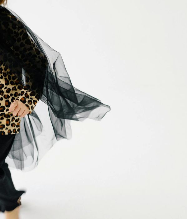 Person in a dynamic yoga flow, captured mid-movement.