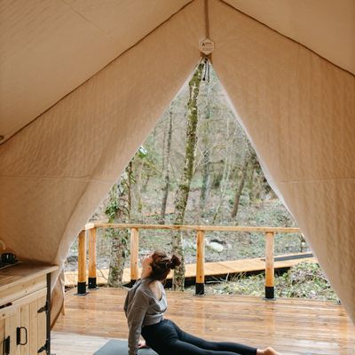 Person practicing deep breathing exercises outdoors.